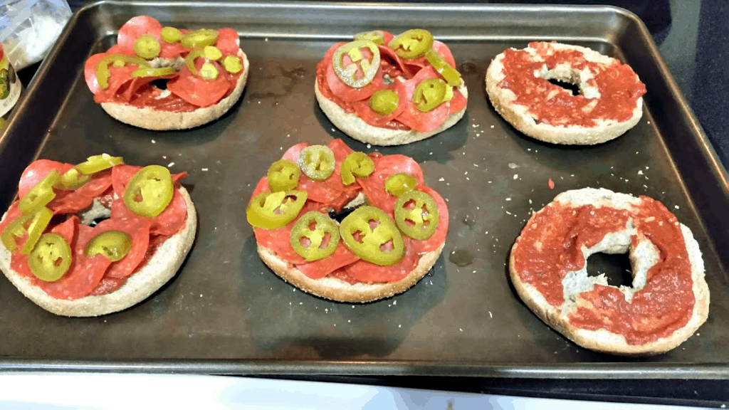 Pizza bagels are an easy and frugal dinner that only takes about 15 minutes to make from start to finish! www.nogettingoffthistrain.com