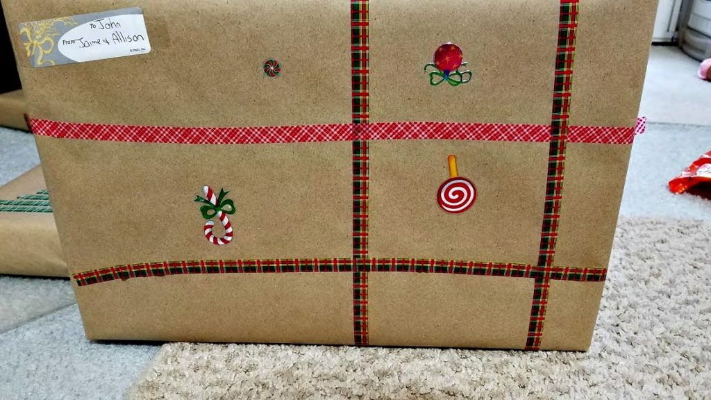 Get creative this holiday season! Here's how to use washi tape to decorate gifts and accent them with Kraft paper and Christmas stickers too!