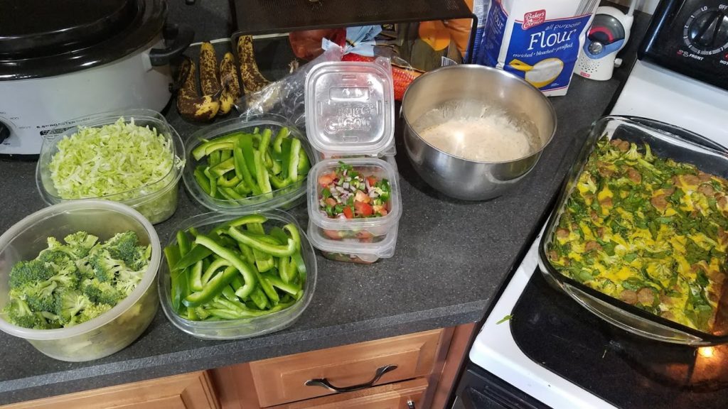 Various containers of meal prepped foods on a countertop