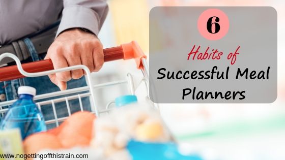 Closeup image of a person pushing a shopping cart with the title "6 habits of successful meal planners"