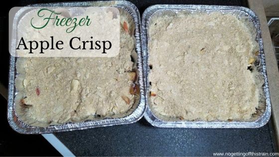 Image of two unbaked apple crisp with the title "Freezer Apple Crisp"