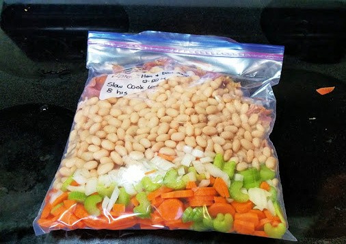 Uncooked ham and bean soup in a Ziploc bag