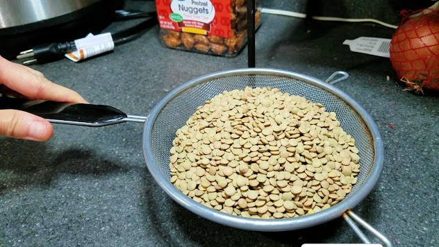 Image of uncooked lentils in a colander