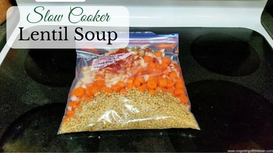 Image of lentil soup in a freezer bag with the title "Slow cooker lentil soup"