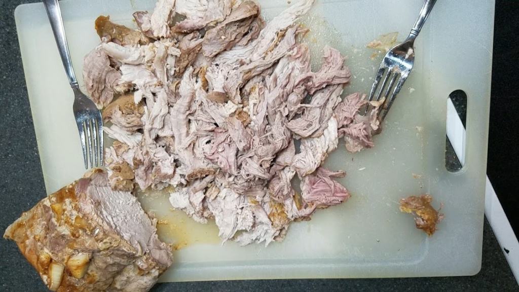 Image of pulled pork on a cutting board