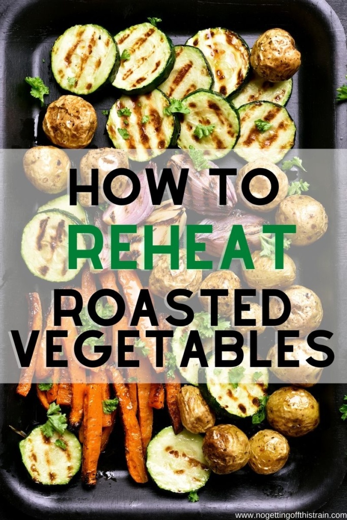 Roasted vegetables on a sheet pan with text "How to reheat roasted vegetables"