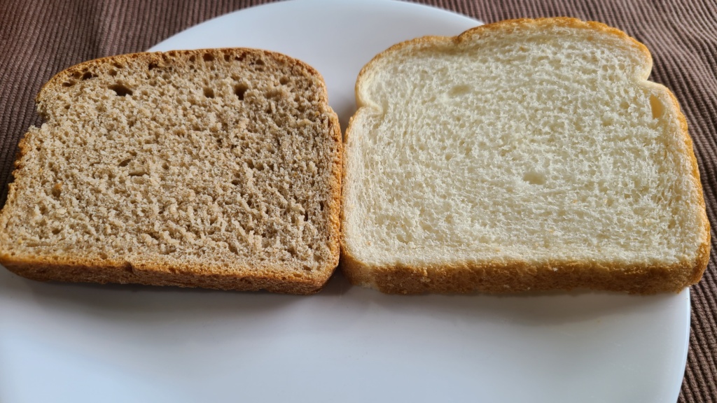 A plate with a slice of homemade bread and store bought bread side-by-side
