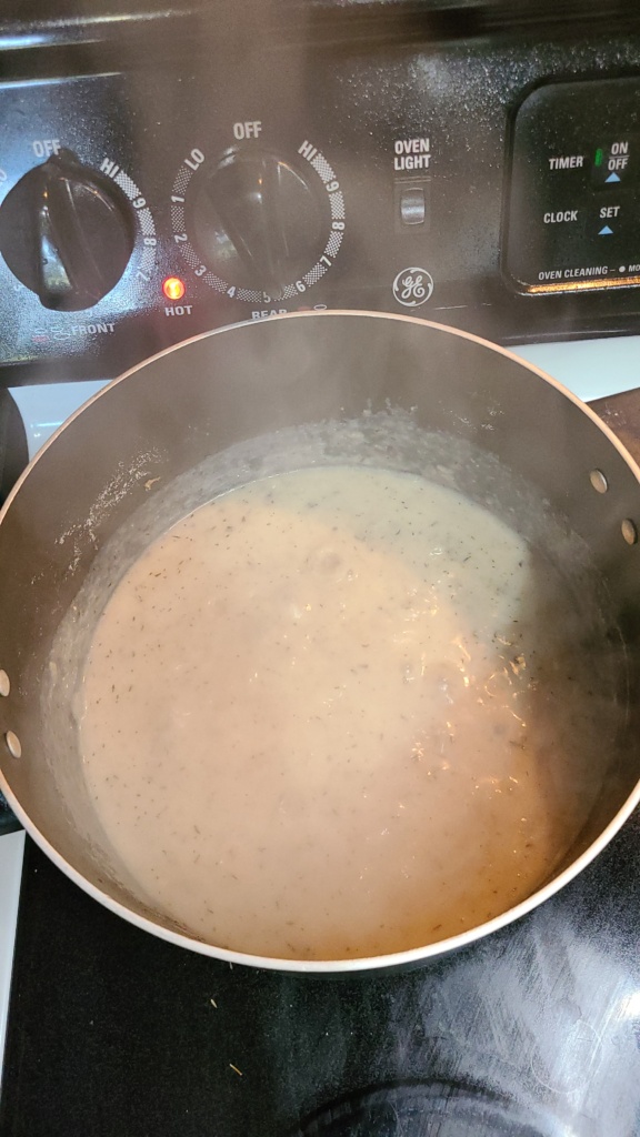 Milk and water mixture bubbling in a large pot