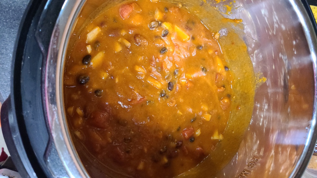 Cooked pumpkin chili in a slow cooker