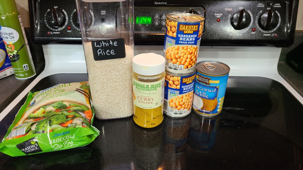 Ingredients for chickpea curry on a stovetop