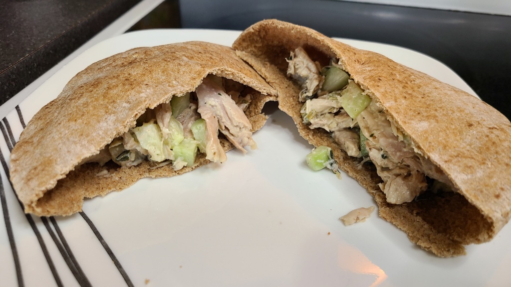 Filled Greek chicken pitas on a plate