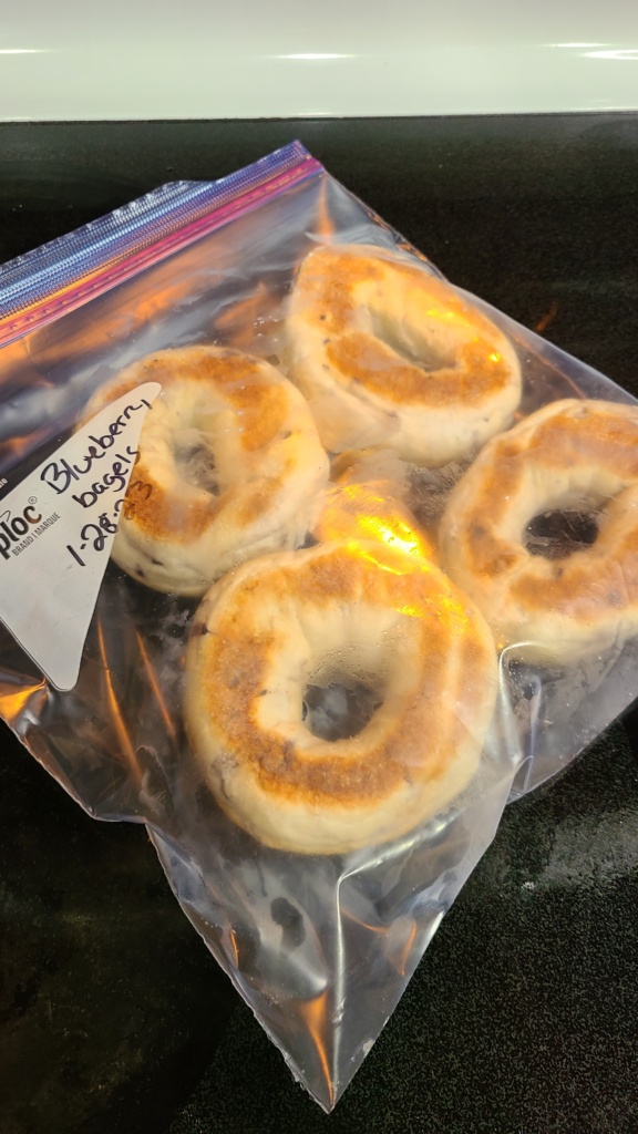 4 frozen bagels in a gallon-sized freezer bag