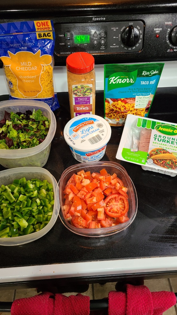 Ingredients for taco salad on a stovetop