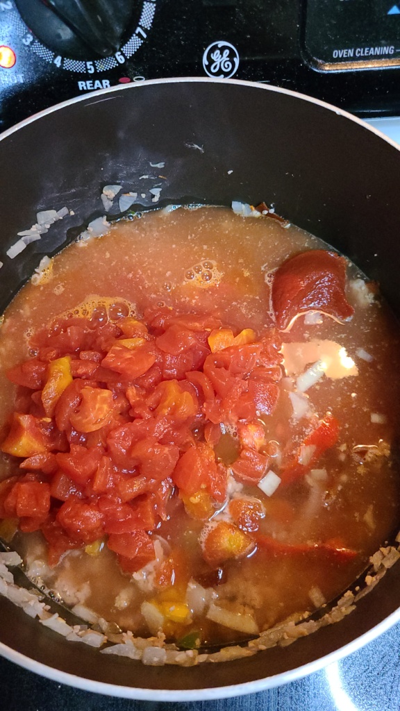 A large pot with ingredients for chili