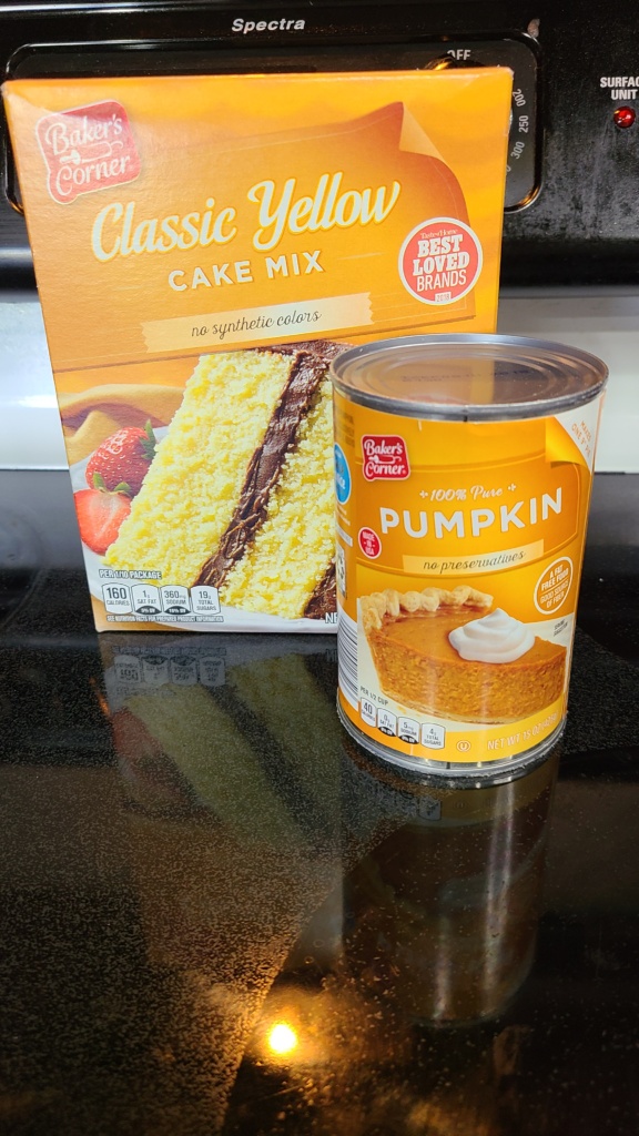 A box of yellow cake mix and a can of pumpkin puree