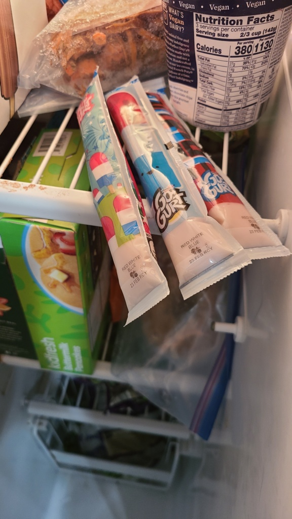3 tubes of Gogurt in a freezer