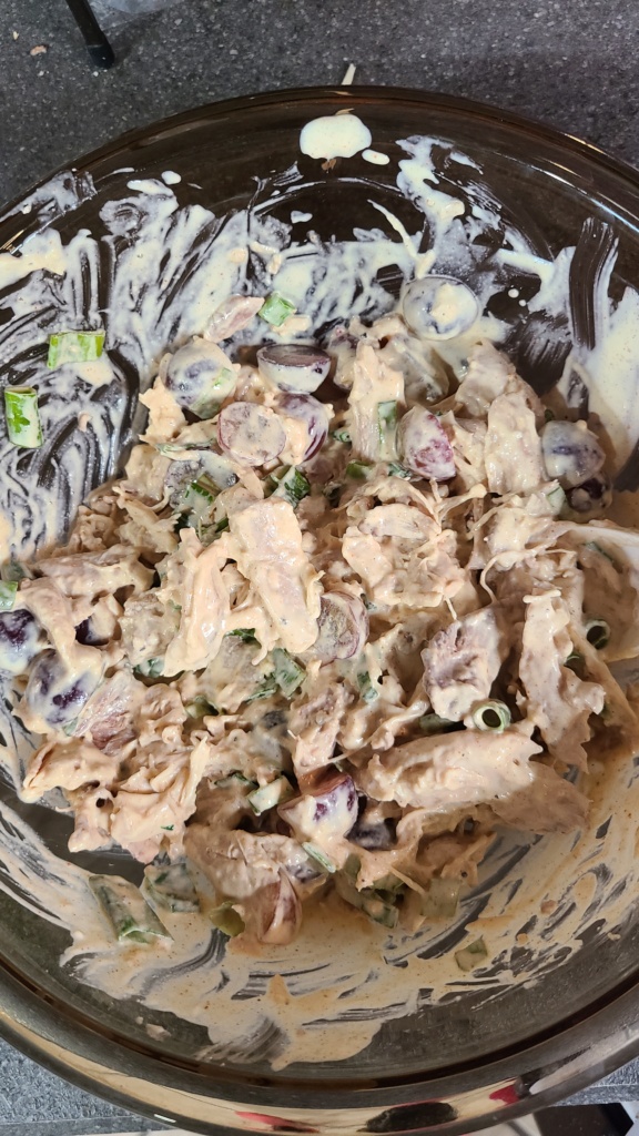 A large bowl filled with mixed chicken salad