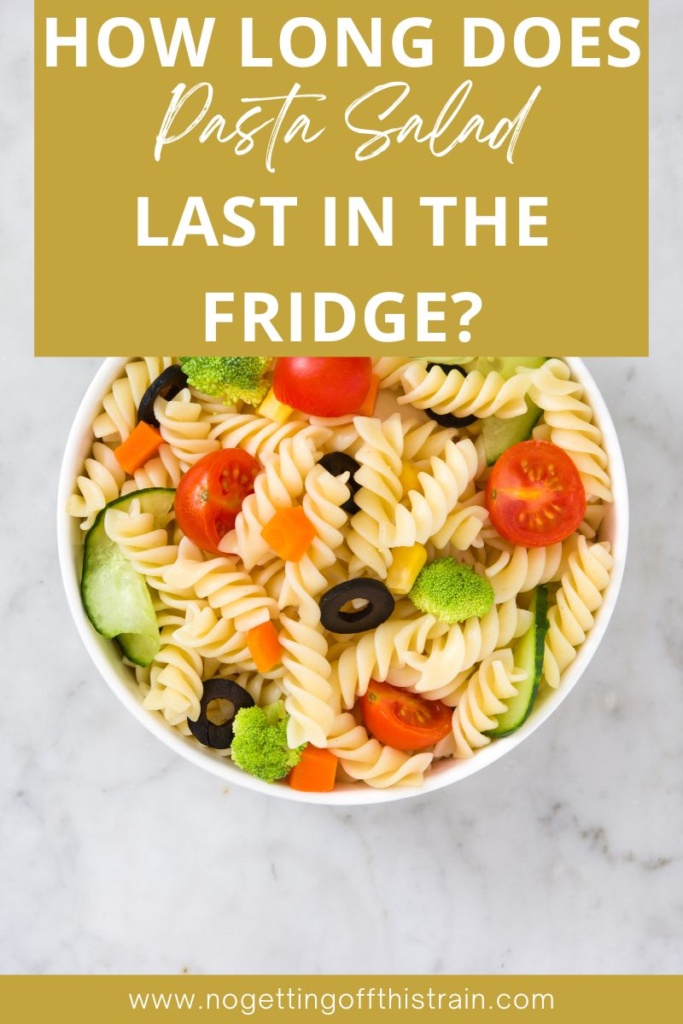 A bowl of pasta salad with text "How long does pasta salad last in the fridge?"