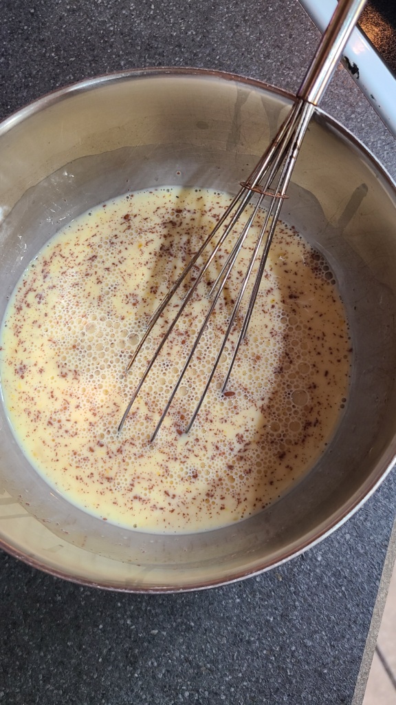 A bowl of egg and milk mixture for French toast