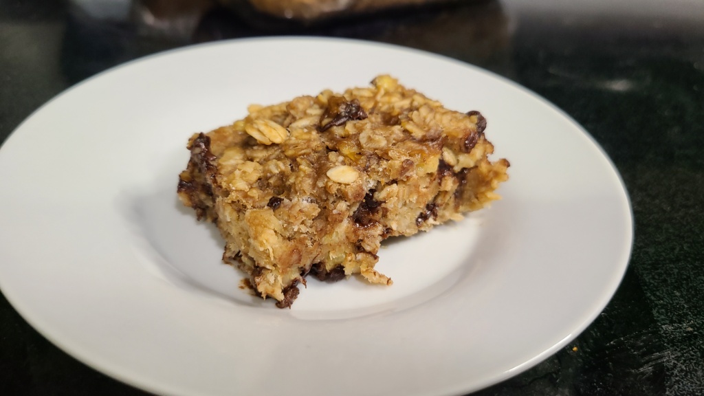 A single banana oatmeal bar on a small plate