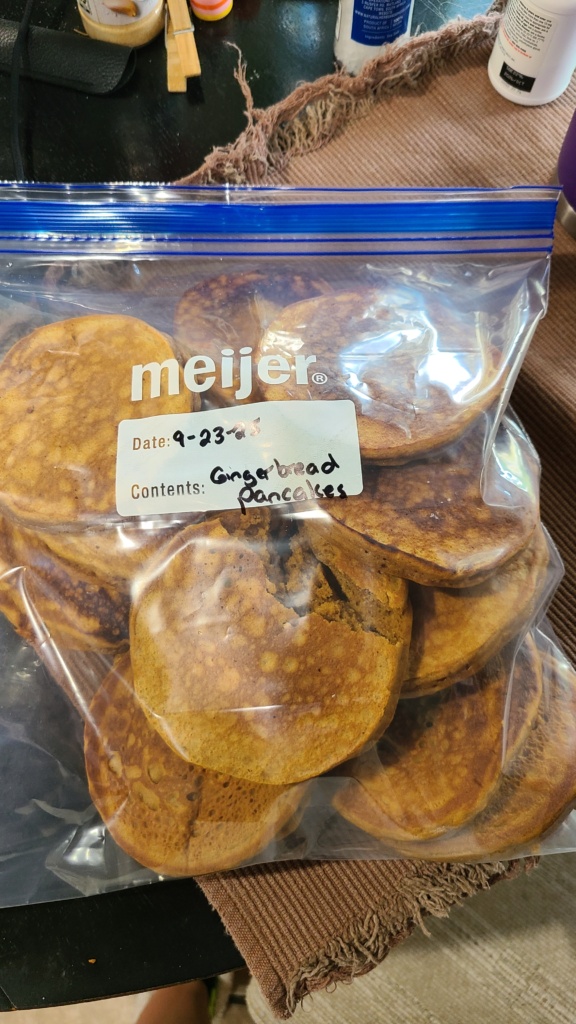 A gallon-sized freezer bag filled with gingerbread pancakes