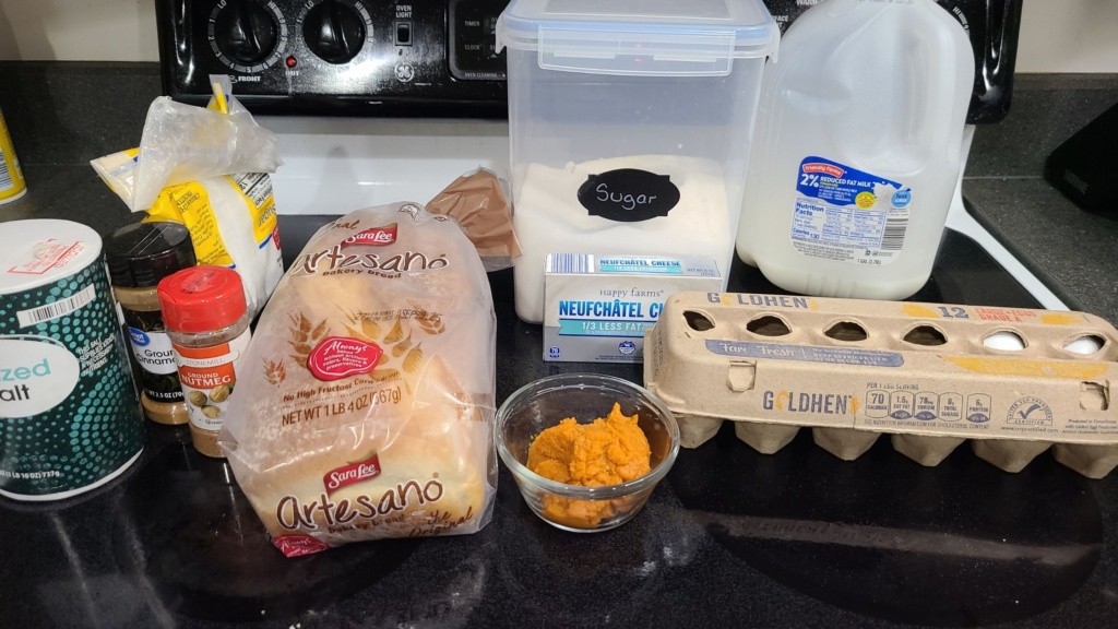 Ingredients for pumpkin cream cheese French toast, on a stovetop