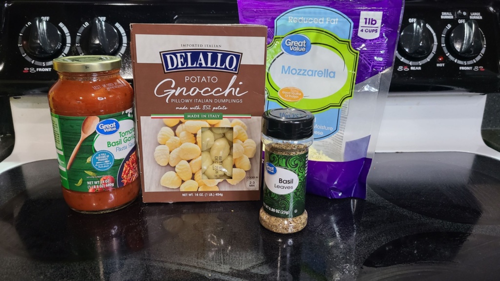Ingredients for baked gnocchi, on a stovetop