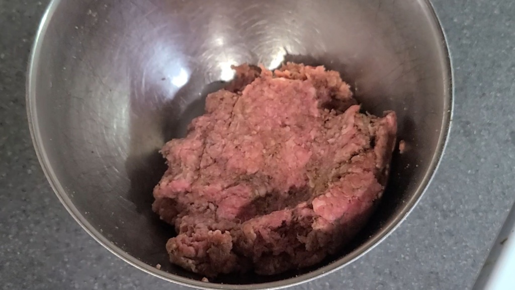 Ground beef mixture in a mixing bowl