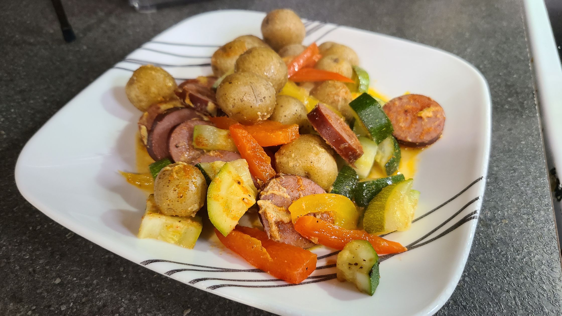 Kielbasa and vegetables on a dinner plate