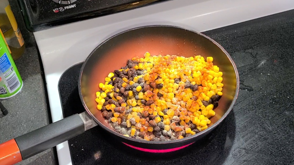 Beans and corn cooking in a skillet