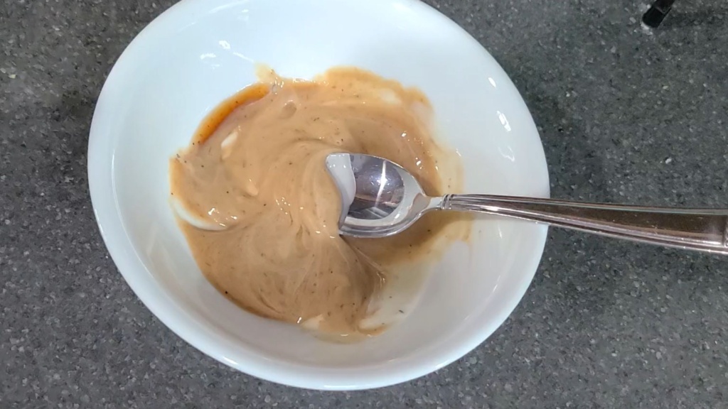 Ranch dressing and BBQ sauce mixed in a small bowl