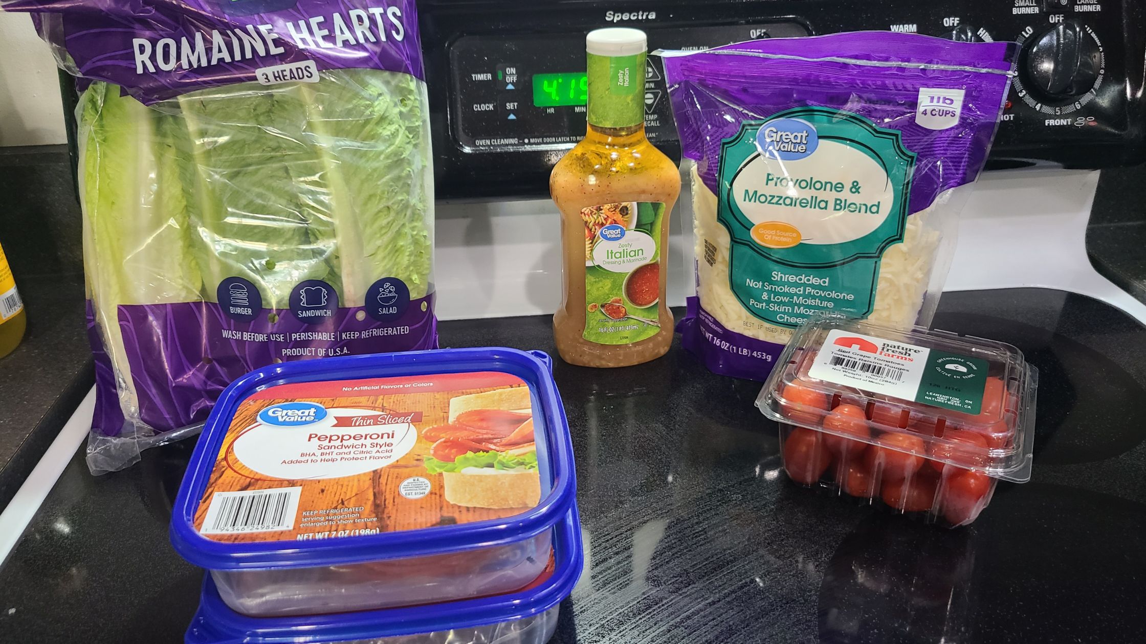 Ingredients for Italian sub salads, on a stovetop