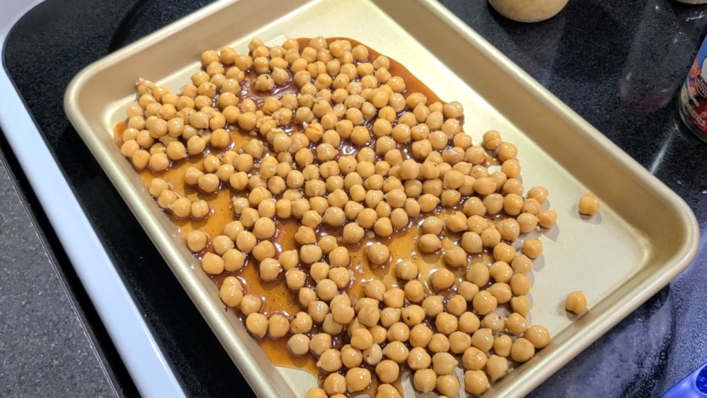 Chickpeas with sauce on a sheetpan