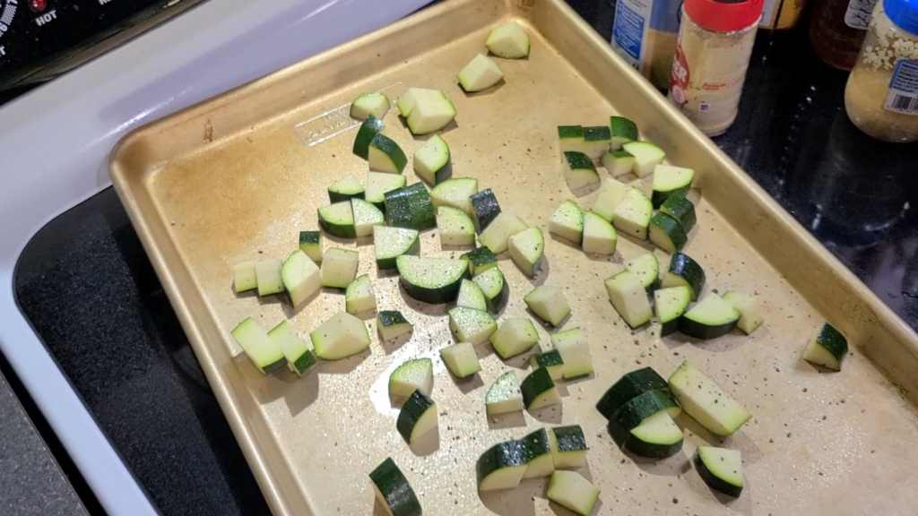 Diced zucchini on a sheet pan
