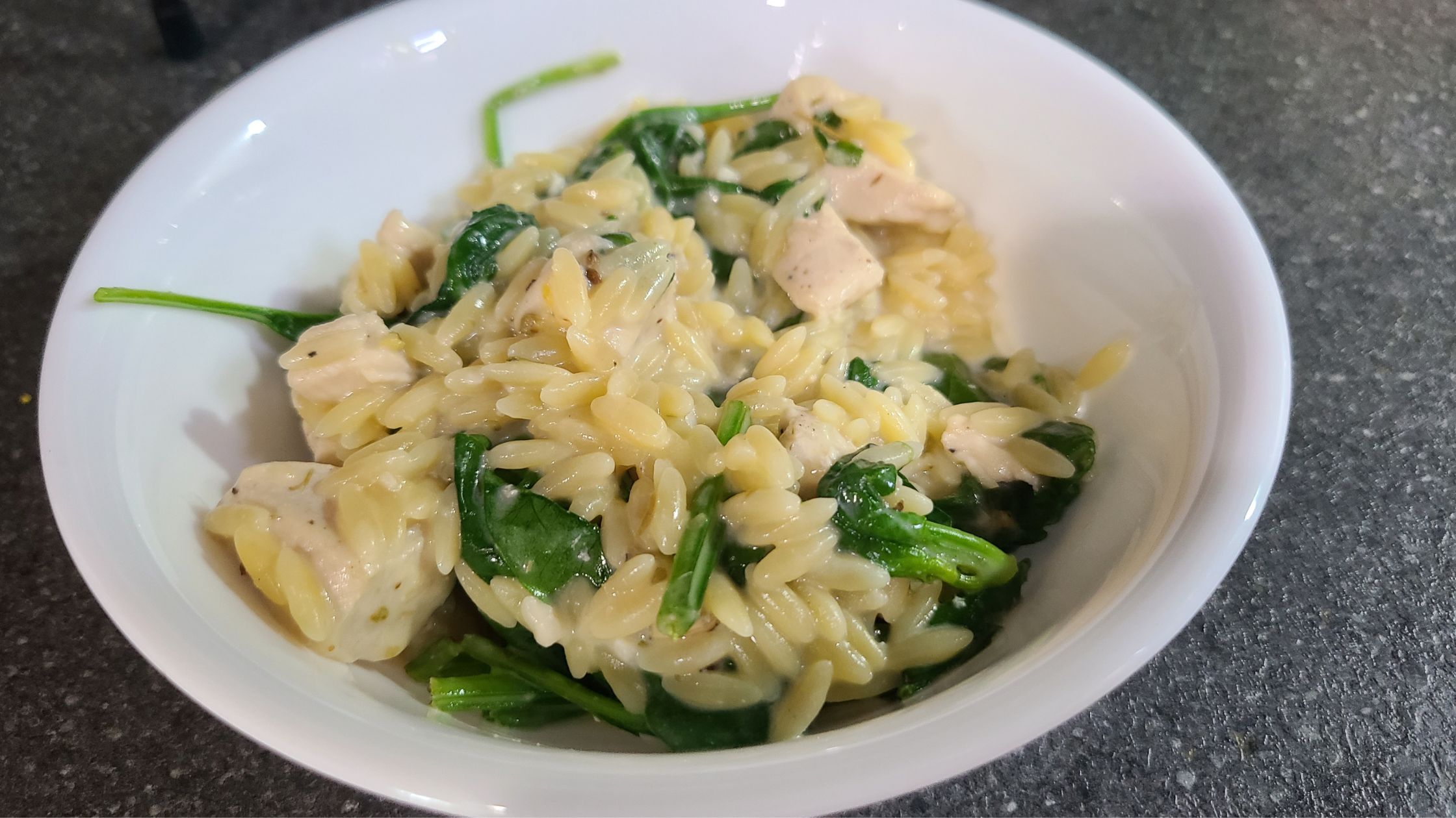 Lemon chicken orzo in a bowl