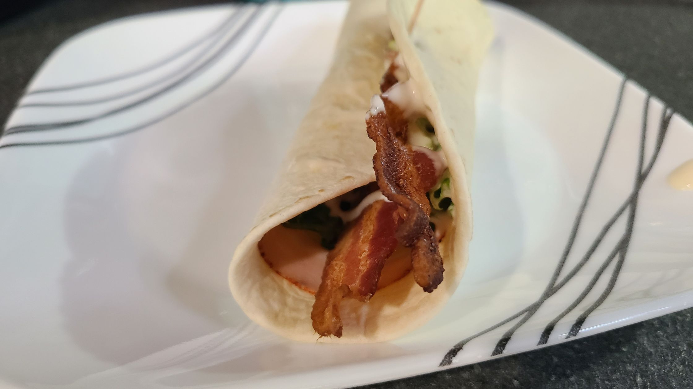 Finished Turkey Bacon Ranch Wrap, on a plate